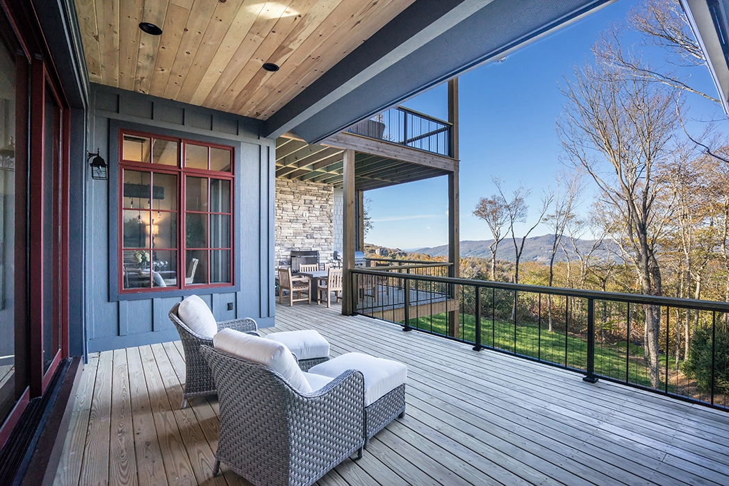 The Oaks deck overlooking the trees and mountains