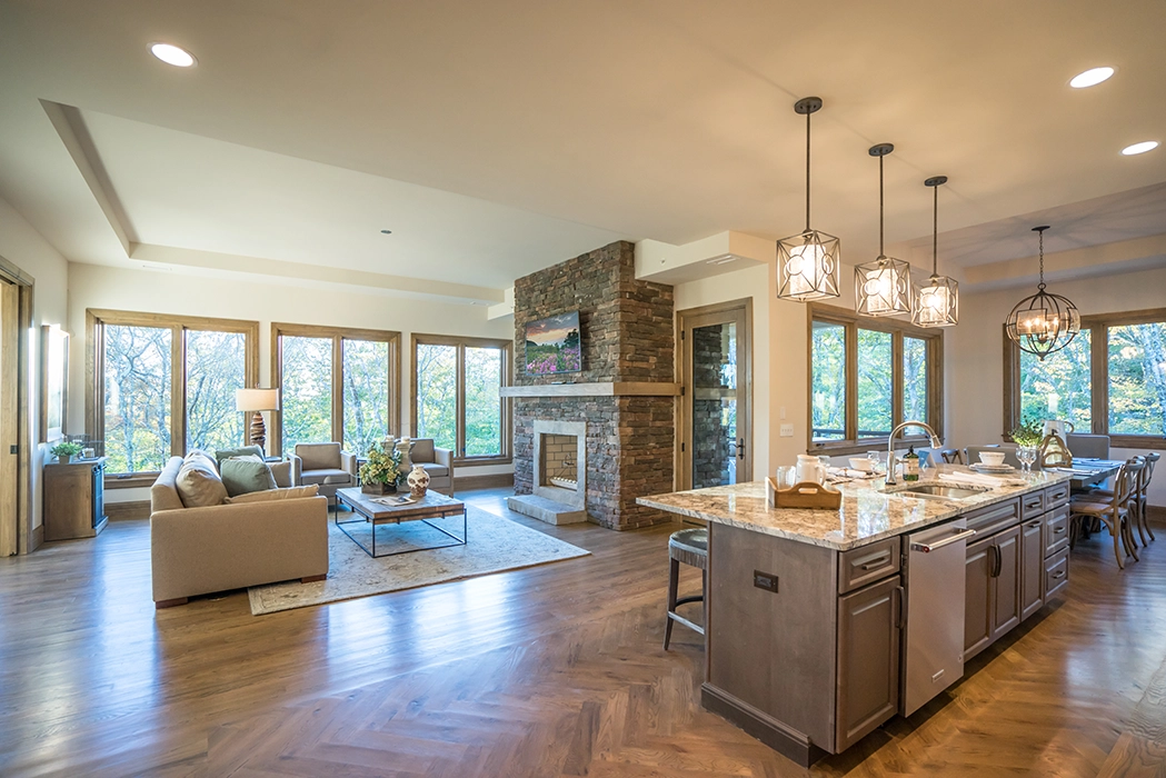 great room with kitchen Island and large windows