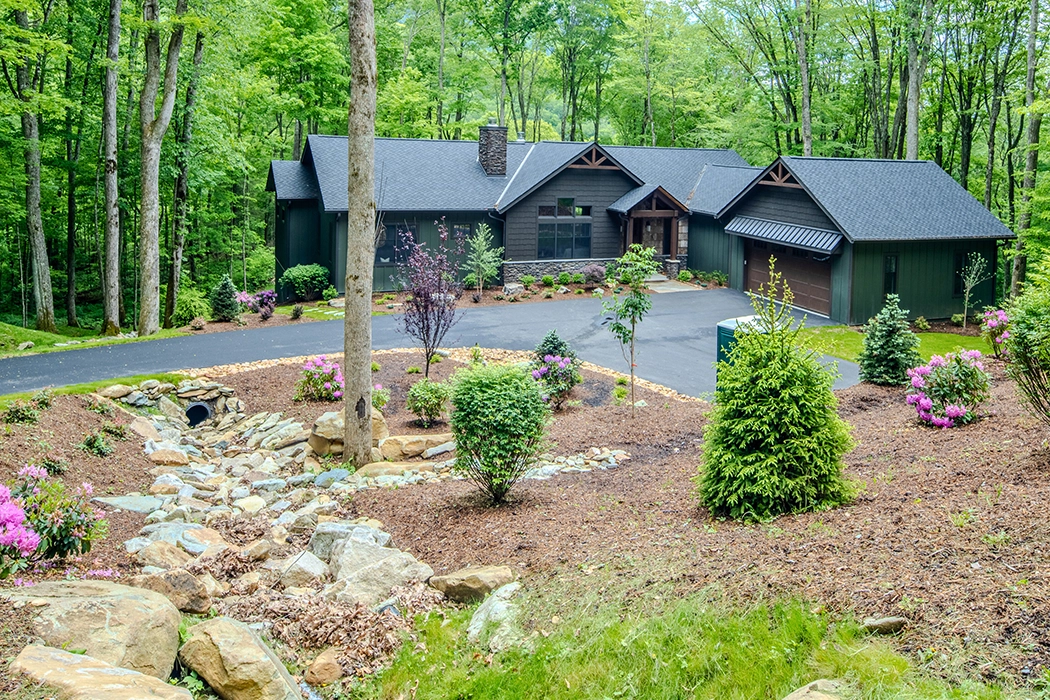 Black exterior of home in the mountain woods