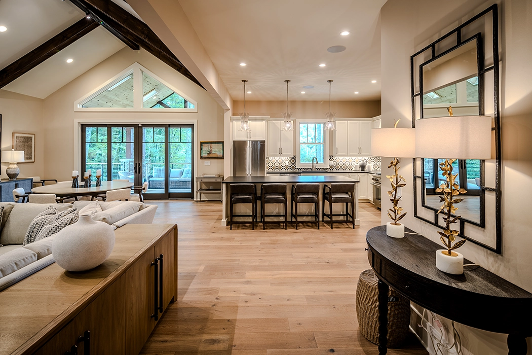 open concept interior with modern kitchen, dining and living area